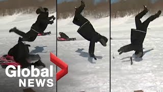 Reporter flipped by sled during news report OFFICIAL VIDEO [upl. by Su]